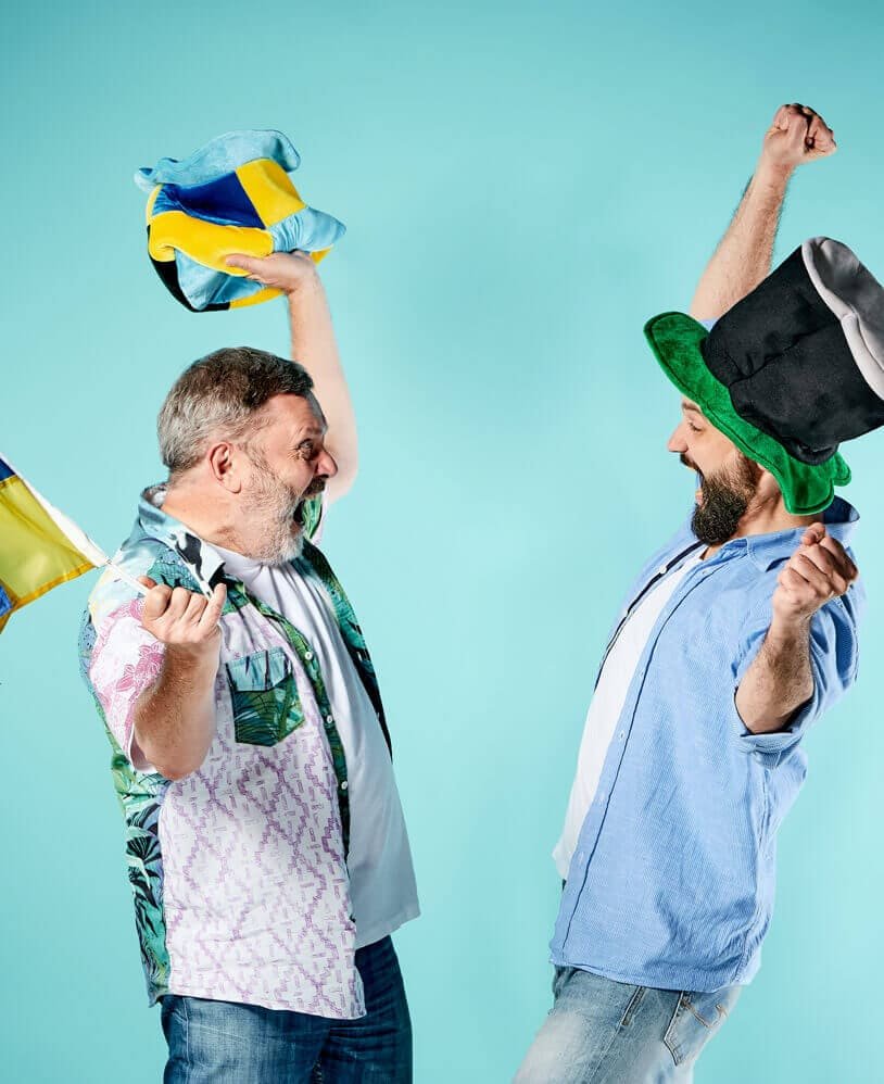 men celebrating with hats